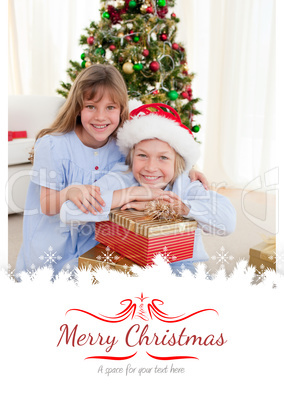 Composite image of happy brother and sister holding christmas pr