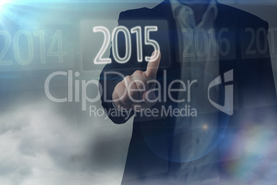 Composite image of businessman standing and pointing