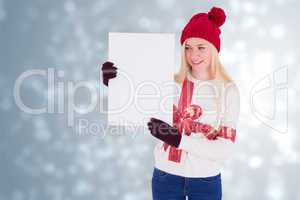 Composite image of festive blonde showing a blank page