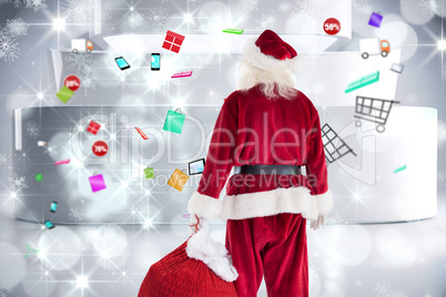 Composite image of santa carrying sack of gifts Composite image of santa carrying sack of gifts