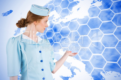 Composite image of pretty air hostess presenting with hand