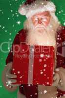 Composite image of father christmas opening a magical christmas