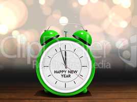 Composite image of happy new year in green alarm clock