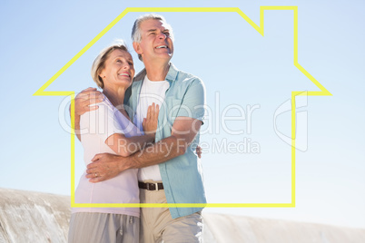 Composite image of happy senior couple embracing on the pier