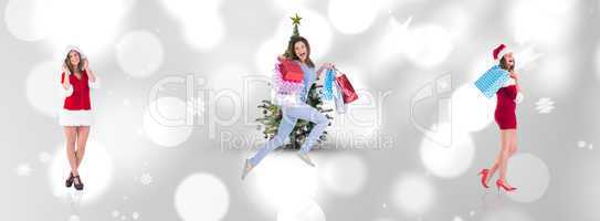 Composite image of festive brunette holding shopping bags