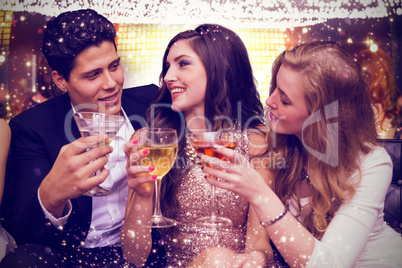 Composite image of friends toasting