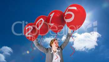 Composite image of excited redhead businesswoman cheering