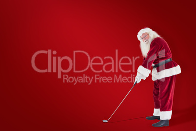 Composite image of santa claus is playing golf