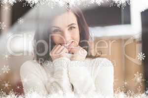 Composite image of brunette in white wool jumper posing