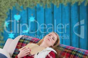 Composite image of woman asleep on couch