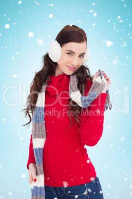 Composite image of happy brunette in winter clothes posing