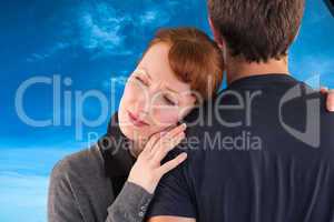 Composite image of scared woman holding onto man