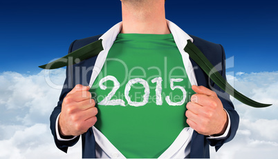 Composite image of businessman opening shirt in superhero style