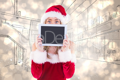 Composite image of pretty santa girl holding tablet