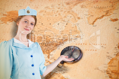 Composite image of pretty air hostess presenting with hand