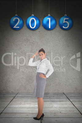 Composite image of focused businesswoman