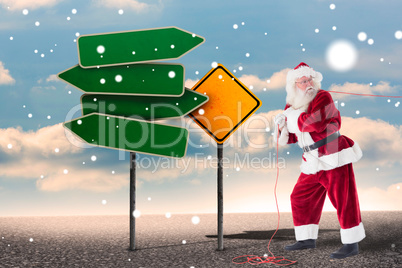 Composite image of santa uses a home trainer