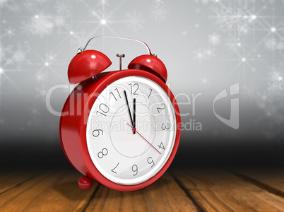 Composite image of alarm clock counting down to twelve