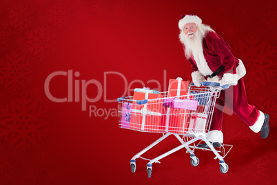 Composite image of santa rides on a shopping cart