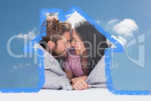 Composite image of couple wrapped in the duvet