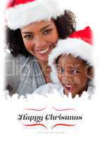 Composite image of mother and daughter having fun at christmas t