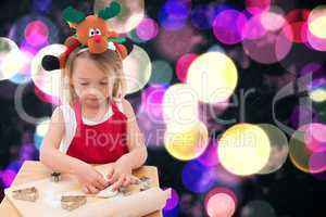 Composite image of festive little girl making cookies