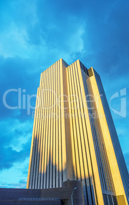 High Tower building against blue sky at sunset