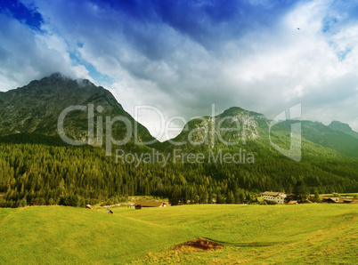 Beautiful Dolimites landscape. Meadows, mountains and sky