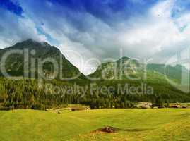 Beautiful Dolimites landscape. Meadows, mountains and sky