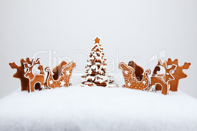 The hand-made eatable reindeer and cart with snow decoration