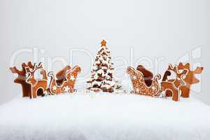 The hand-made eatable reindeer and cart with snow decoration