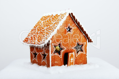 The hand-made eatable gingerbread house and snow decoration