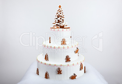 The artificial cake decorated with  hand-made eatable gingerbrea