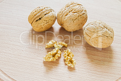 Walnuts on rustic  wooden table