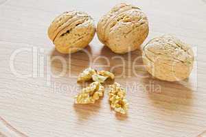 Walnuts on rustic  wooden table