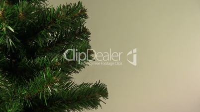 Christmas or New Year's  tree rotates on abstract background