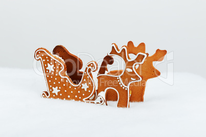 The hand-made eatable reindeer and cart with snow decoration