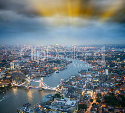The Tower Bridge in London with river Thames and dramatic sunset