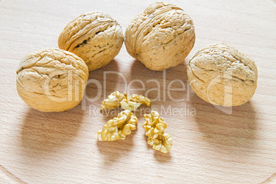 Walnuts on rustic  wooden table