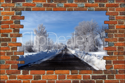 broken brick wall and view to Winter highway