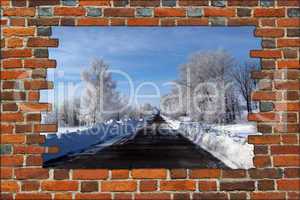 broken brick wall and view to Winter highway