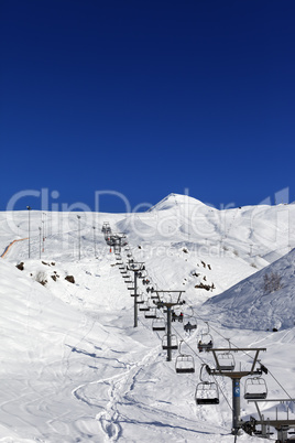 Winter mountains and ski slope at nice day