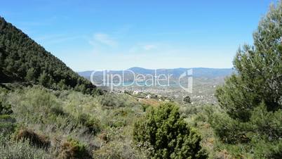 Panoramic of mountains and lake tilt