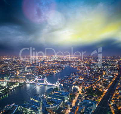 The Tower Bridge in London with river Thames and dramatic sunset