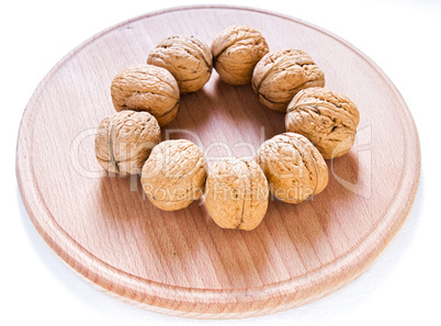 Walnuts on rustic  wooden table