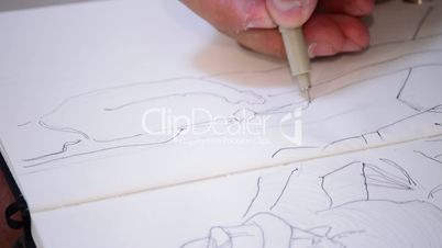 Pencil of sketcher paint in a book