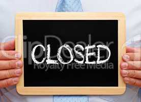 Closed - Businessman with chalkboard