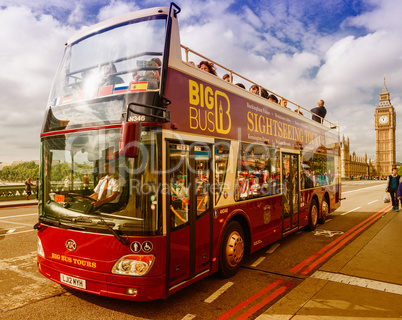 LONDON - SEPTEMBER 29, 2013: Bus sightseeing tour in front of Bi