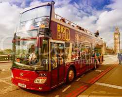 LONDON - SEPTEMBER 29, 2013: Bus sightseeing tour in front of Bi