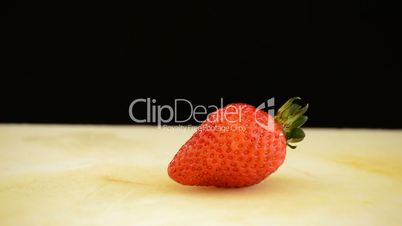 Professional chef hands cutting a strawberry in small cubes